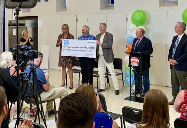 The Idaho Lottery Commission presents a $51,250,000 check to the Idaho Department of Education at Emmett Middle School.